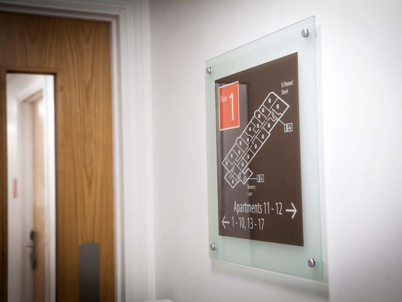 A wayfinding sign to show the directions to apartments on the specific floor
