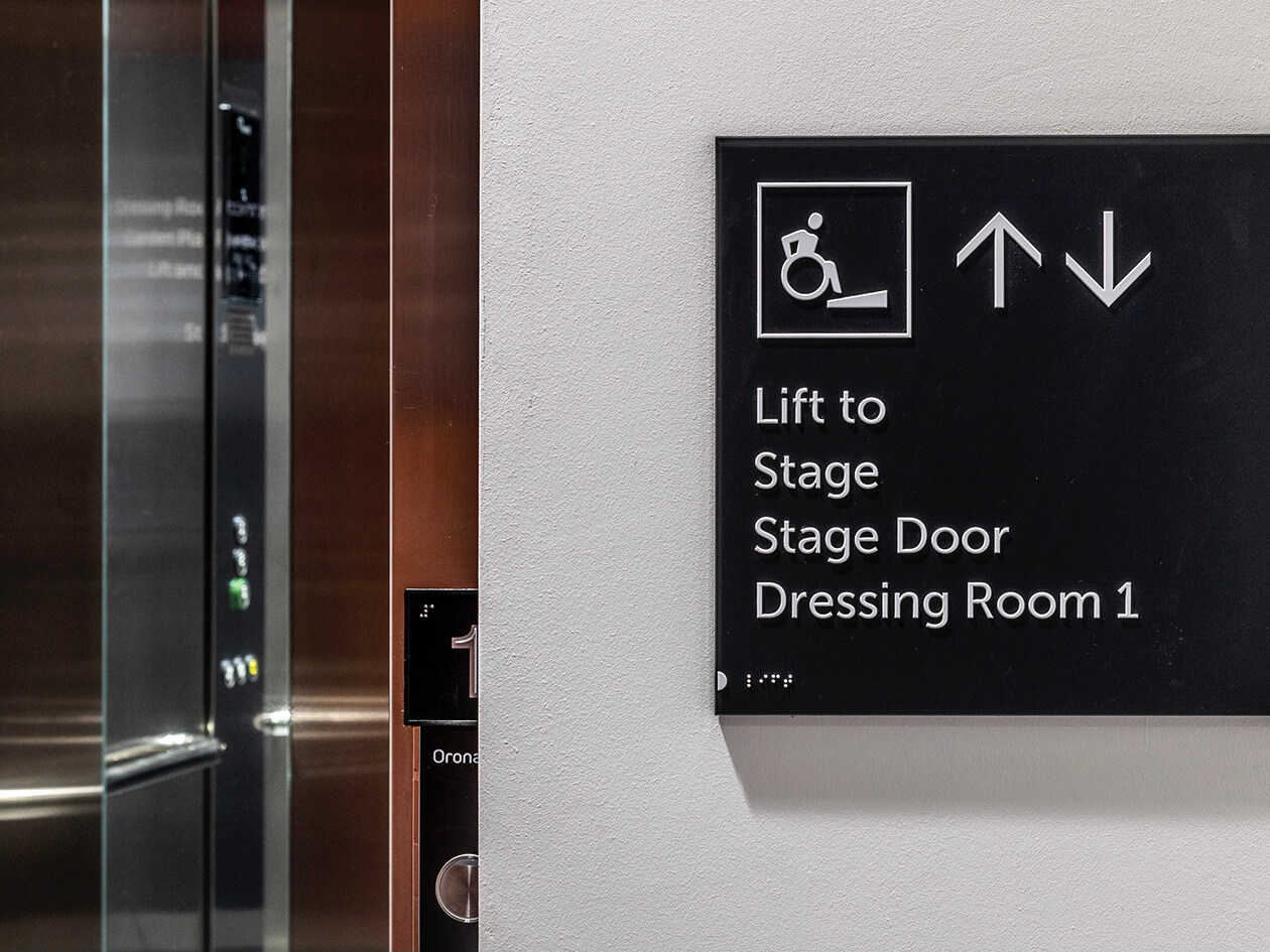 inclusive tactile and Braille lift signage